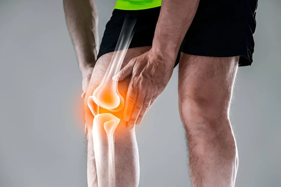 Runner holding a painful knee — sports injuries from ACL tears to ankle sprains