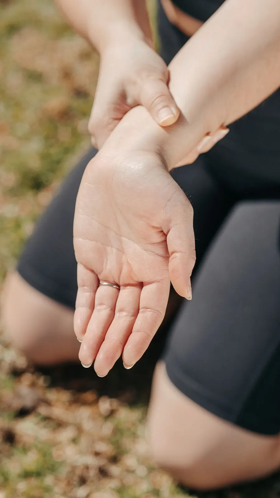 Person holding a painful wrist — the night tingling of carpal tunnel syndrome starts here